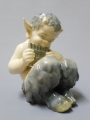 Christian Thomsen (1860-1921): Porzellanplastik - Faun mit Panflöte, Entwurf um 1900, Ausführung um 1923 von Königliche Porcelainsfabrik Kopenhagen